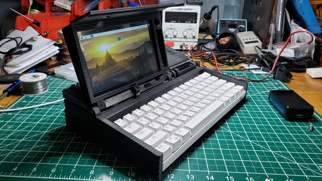 My cyberdeck booted up and complete, running Debian Linux with an HD touchscreen